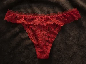 Women’s red floral lace thong panty with soft fabric and scalloped waistband